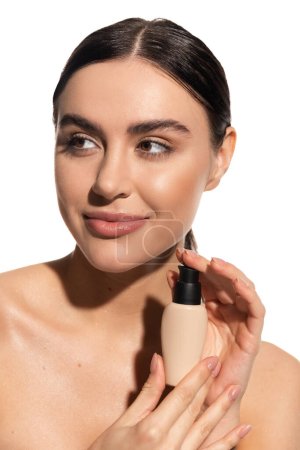 brunette woman holding bottle with liquid makeup foundation isolated on white 