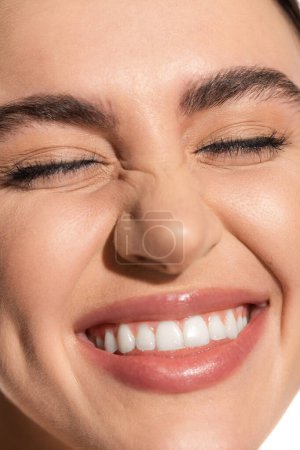 close up of happy young woman with flawless natural makeup