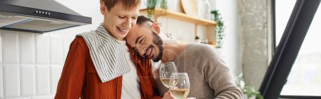 overjoyed bearded man leaning on redhead boyfriend while clinking wine glasses in kitchen, banner
