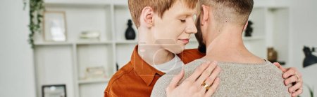 happy gay man in wedding ring embracing boyfriend at home, banner