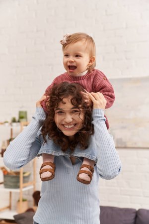 cheerful woman with baby girl on shoulders, balanced lifestyle, mom daughter time, having fun together, quality time, work and life harmony, loving motherhood, happiness 