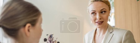 Photo for Mother and daughter spending quality time together, blonde woman talking to preteen girl, looking at child, working parent and kid, modern parenting, family bonding, blurred foreground, banner - Royalty Free Image