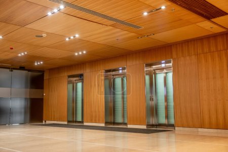 modern hotel interior with sophisticated lobby design, elevators, convenience, classy and luxurious ambience, spacious and comfort, elegance and chic, nobody shot