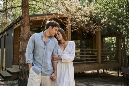 happy woman in white sundress holding hands with boyfriend, summer house, romance and love, joy