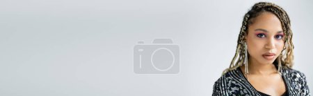 Photo for Banner, fashion, african american woman looking at camera on grey background, bold makeup - Royalty Free Image