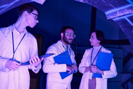 Futuristic Collaboration: Scientists of Varied Ages Converge in Neon-Lit Science Center