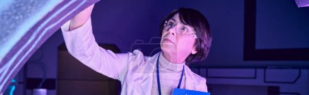 Photo for Banner, Futuristic Expertise: Adult Woman Scientist in the Science Center of Tomorrow - Royalty Free Image