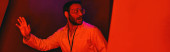 frightened indian scientist looking away in red neon light, unknown phenomenon, banner puzzle #668555464