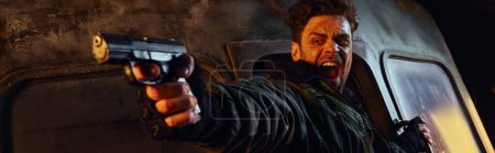 unshaven character with gun shooting and shouting in darkness of  post-apocalyptic subway, banner