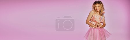 beautiful woman in pink outfit holding magic wand on pink background, tooth fairy concept, banner