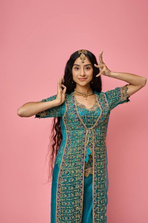 Photo for Vertical shot of attractive young indian woman in blue sari with accessories gesturing lively - Royalty Free Image