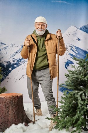 sporty Santa in warm jacket and white hat standing on skis near tree stump, winter concept