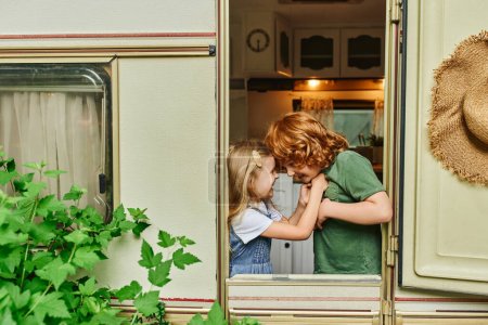 joyful brother and sister having fun inside trailer home, happiness and siblings relationship