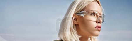 Photo for Attractive woman in stylish glasses wearing warm jacket and looking away, winter fashion, banner - Royalty Free Image