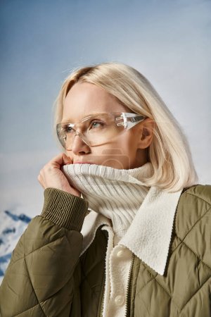 attractive fashionista woman with glasses covering her mouth with her collar, winter fashion