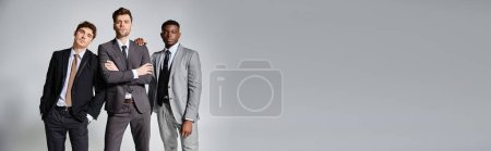 appealing interracial friends in smart business suits posing together on gray background, banner puzzle 685860720