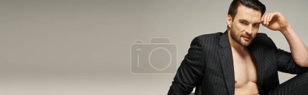 horizontal banner of cheerful man with bare chest posing in pinstripe suit on grey background mug #692776500