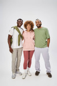happy african american friends standing and hugging on grey background, Juneteenth celebration Stickers #695321354