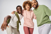 cheerful african american men and woman standing on grey background, Juneteenth celebration Sweatshirt #695321534
