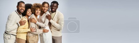 Foto de Estandarte de la gente afroamericana feliz de pie en traje elegante sobre fondo gris, Juneteenth - Imagen libre de derechos