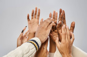 cropped shot of african american people outstretching hands on grey background, Juneteenth concept magic mug #695323920