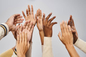 cropped shot of african american community outstretching hands on grey background, Juneteenth magic mug #695323958