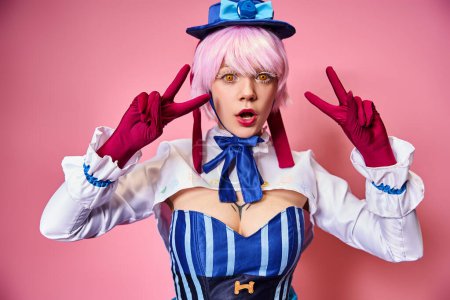 surprised young woman cosplaying anime character and showing peace gesture and looking at camera