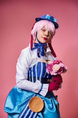 appealing cute female cosplayer in vibrant costume holding pink flowers and looking at camera