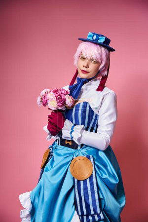 beautiful cute female cosplayer in vibrant costume holding pink flowers and looking at camera