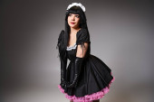 appealing woman in black maid costume cosplaying anime character and looking away on gray backdrop magic mug #699819352