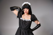 alluring female cosplayer in sexy maid costume showing crying gesture and looking at camera magic mug #699819912