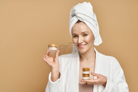 Photo for An attractive woman in a flowing white robe gracefully holds a jar of cream, exuding an aura of natural beauty and elegance. - Royalty Free Image