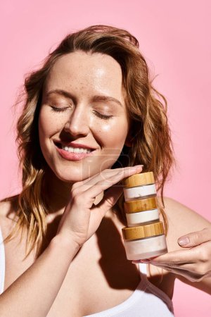 An attractive woman with natural beauty holding cream.