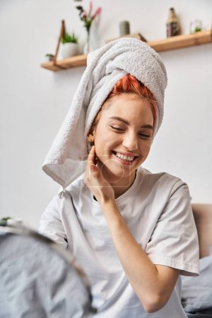 Photo for Joyful extravagant person with white hair towel looking in mirror during morning routine at home - Royalty Free Image