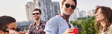 joyful friends with stylish sunglasses drinking at rooftop party and dancing to DJ set, banner