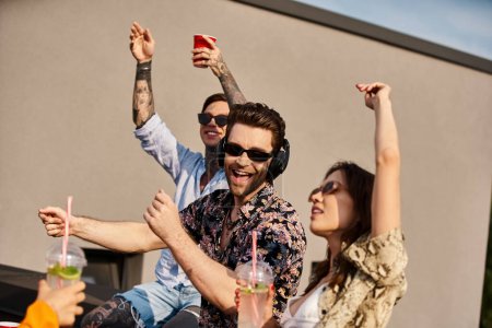 appealing jolly friends with urban vivid attires with stylish sunglasses partying on rooftop