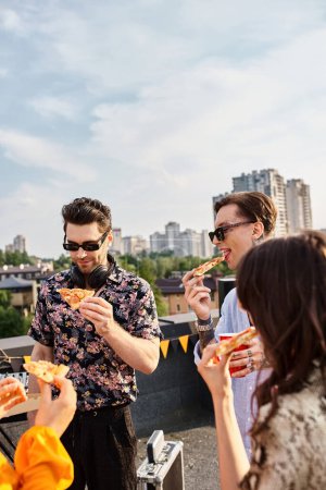 joyous good looking friends in casual vivid attires eating pizza and enjoying drinks at party