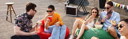 merry diverse young friends in vibrant attires with sunglasses enjoying pizza and drinks, banner