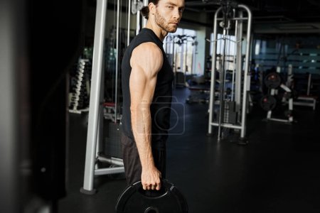 Photo for A focused man in gym attire holding a barbell, showcasing determination and strength during his workout routine. - Royalty Free Image