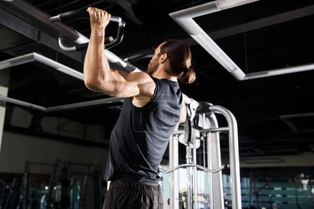 An athletic man in active wear lifts a bar in a gym, muscles flexed, showcasing strength and determination.