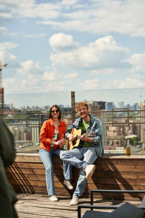 A man and a woman sit on a bench, strumming guitars in sync, creating a harmonious melody in a serene setting