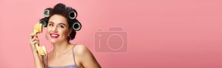 Photo for Appealing woman gracefully holding retro phone. - Royalty Free Image