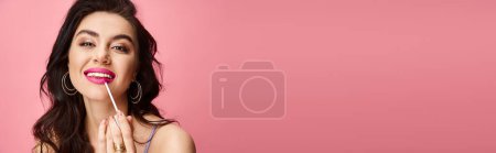 Photo for A woman with natural beauty confidently applying lipgloss. - Royalty Free Image