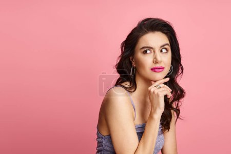 Photo for A natural beauty strikes a pose in front of a vivid pink background. - Royalty Free Image