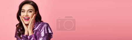 Photo for A woman in a purple sequin dress strikes a pose for the camera. - Royalty Free Image