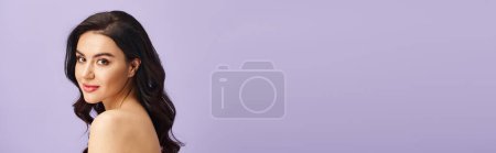 Photo for A stunning woman with long hair and natural beauty poses gracefully. - Royalty Free Image