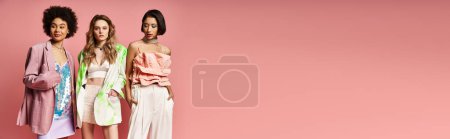 Photo for A group of women of different ethnicities and backgrounds stand together against a pink studio backdrop, showcasing beauty and unity. - Royalty Free Image