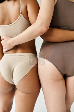 Photo for Diverse women standing in pastel underwear. - Royalty Free Image