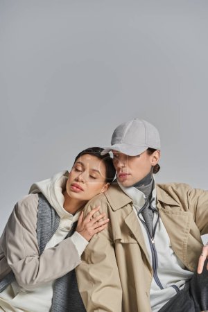 Téléchargez les photos : A man and a stylish young woman, embodying elegance and connection. - en image libre de droit