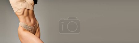 Photo for A womans elegantly posing in nude lingerie. - Royalty Free Image